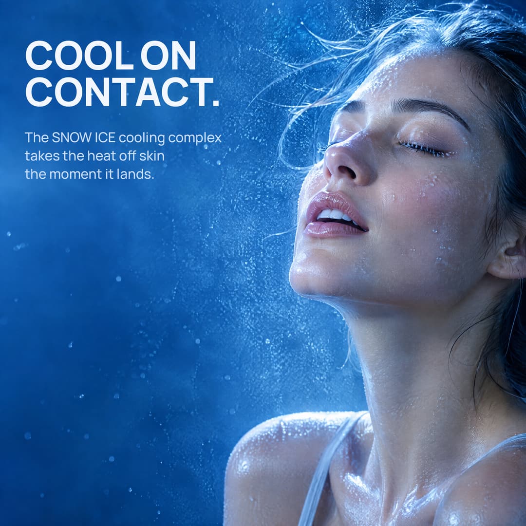 A woman turning her face into a cold mist: cool on contact