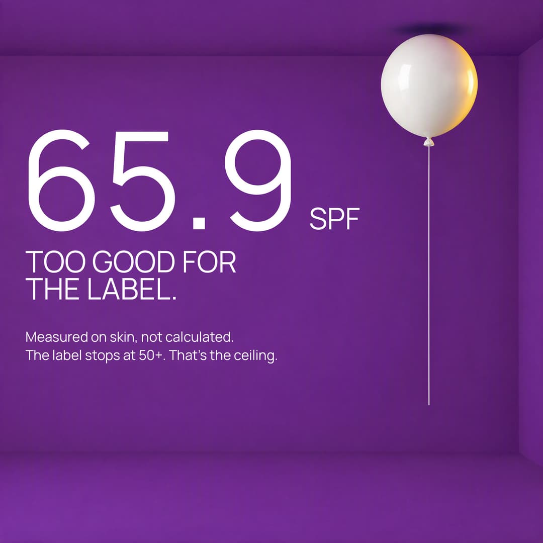 A white balloon floating under a violet ceiling: SPF 65.9, too good for the label
