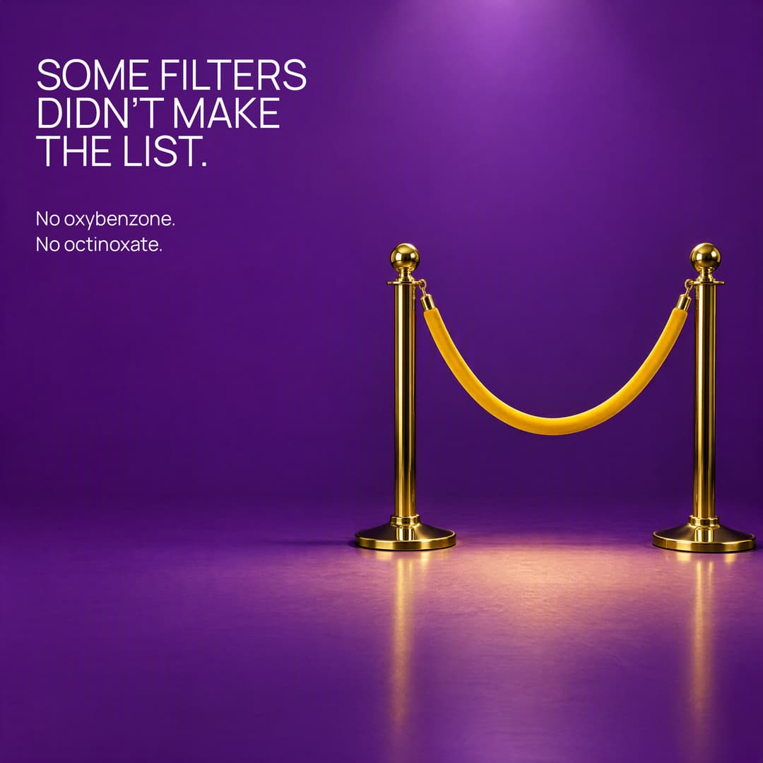 Brass stanchions and a yellow velvet rope before an empty violet floor: no oxybenzone, no octinoxate